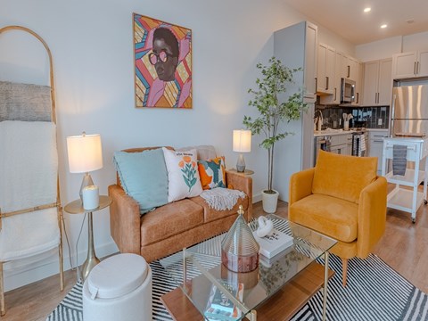 a living room with two couches and a glass table
